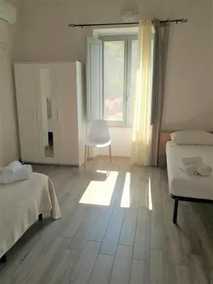 Letto o letti in una camera di Casa dei Talenti