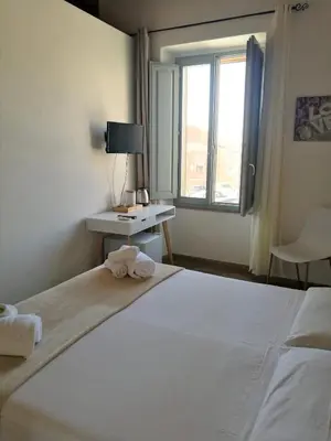 Letto o letti in una camera di Casa dei Talenti