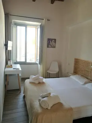 Letto o letti in una camera di Casa dei Talenti