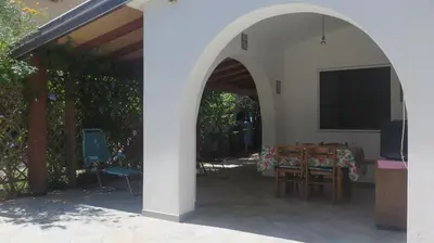 Patio o area all'aperto di Casa con giardino sulla spiaggia