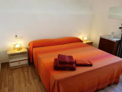 Letto o letti in una camera di Lucia Holiday House Porto Pino