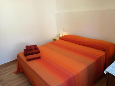 Letto o letti in una camera di Lucia Holiday House Porto Pino