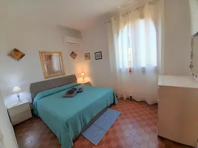 Letto o letti in una camera di Nuova Valmar Villa Carta 100 mt mare
