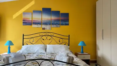 Letto o letti in una camera di Casa vacanze da Roberta a pochi km da Oristano