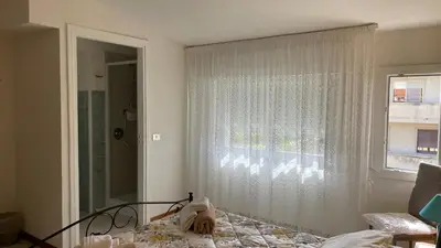 Letto o letti in una camera di Casa vacanze da Roberta a pochi km da Oristano