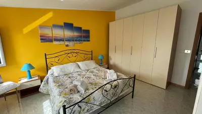 Letto o letti in una camera di Casa vacanze da Roberta a pochi km da Oristano