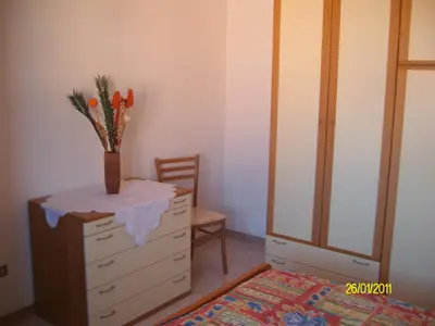 Letto o letti in una camera di Casa Roberta