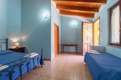 Letto o letti in una camera di Agriturismo La Grotta Del Tesoro