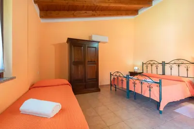 Letto o letti in una camera di Agriturismo La Grotta Del Tesoro