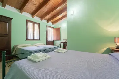 Letto o letti in una camera di Agriturismo La Grotta Del Tesoro