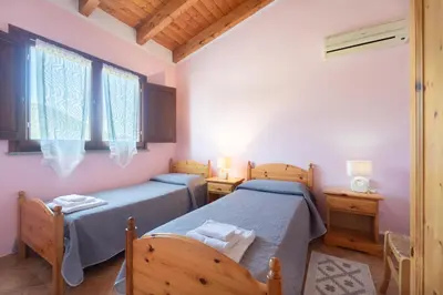 Letto o letti in una camera di Agriturismo La Grotta Del Tesoro
