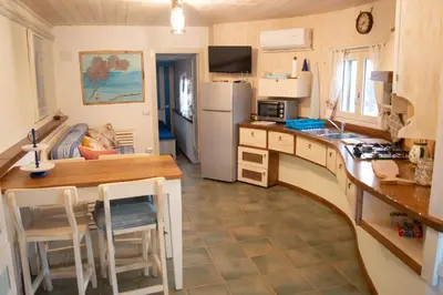 Cucina o angolo cottura di Nel verde del Villaggio - Casetta Celeste