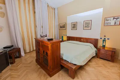 Letto o letti in una camera di Maison Savoia B&b Apartment