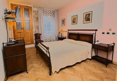 Letto o letti in una camera di Maison Savoia B&b Apartment