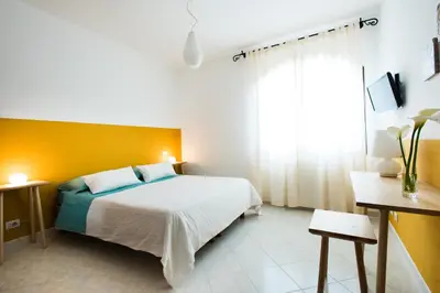Letto o letti in una camera di B&B Sa Cruxitta