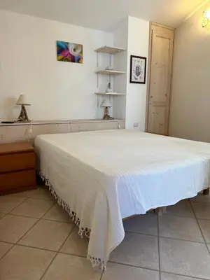 Letto o letti in una camera di Casa Au scheggiu de Sabetta