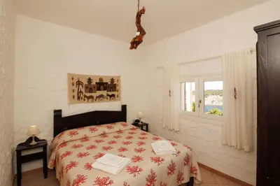 Letto o letti in una camera di Villaggio polifemo 38 Località Cala Sapone P7167