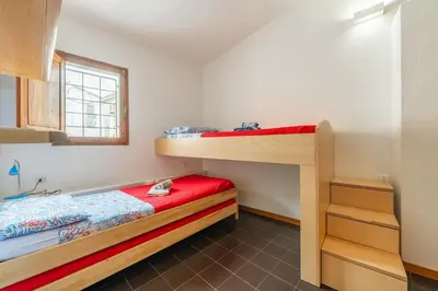 Letto o letti in una camera di Casa Arcobaleno Carloforte
