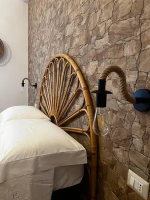 Letto o letti in una camera di ASSUMBRA Casa Vacanze