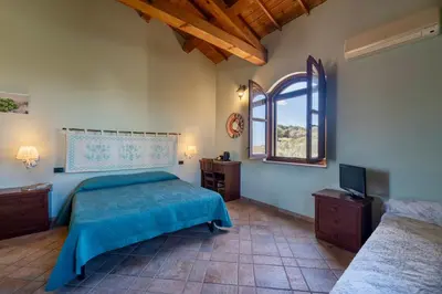 Letto o letti in una camera di Nuraximannu Boutique B&B