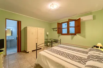 Letto o letti in una camera di Nuraximannu Boutique B&B