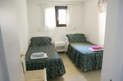 Letto o letti in una camera di Appartamenti in Casa Janas