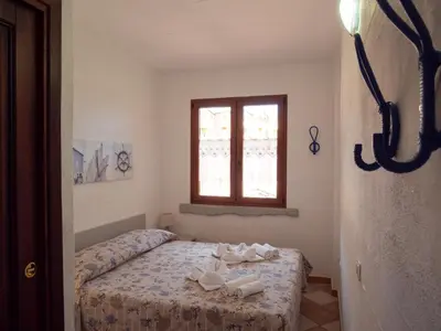 Letto o letti in una camera di Il Blu Tanca Piras