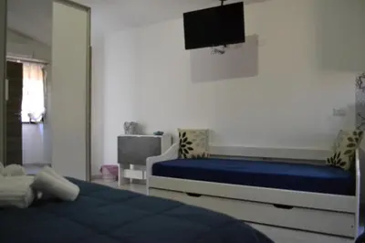 Letto o letti in una camera di Sa domu rubia