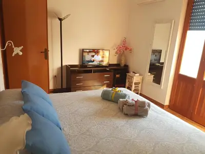Letto o letti in una camera di Casa Vacanze Fronte Mare Calasetta 