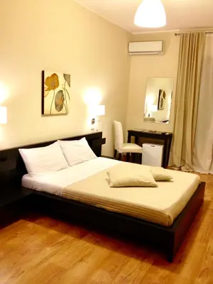Letto o letti in una camera di Bella Cagliari B&B