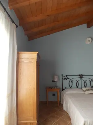 Letto o letti in una camera di B&B PIBITZOI