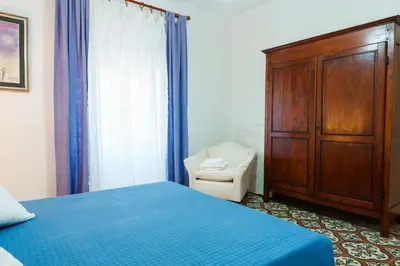 Letto o letti in una camera di Alle Pavoncelle casa vacanze con terrazzo di 50 mq