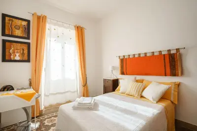 Letto o letti in una camera di Alle Pavoncelle casa vacanze con terrazzo di 50 mq