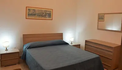 Letto o letti in una camera di Petrus Vacanze