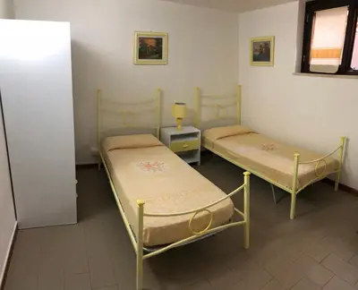 Letto o letti in una camera di MARIA'S HOUSE