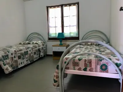 Letto o letti in una camera di MARIA'S HOUSE