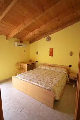 Letto o letti in una camera di B&B Il Nido