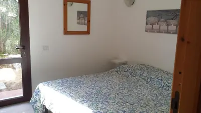 Letto o letti in una camera di Bilocale a pochi passi dal mare