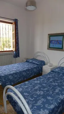 Letto o letti in una camera di B&B VILLA ELISA