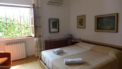 Letto o letti in una camera di B&B VILLA ELISA