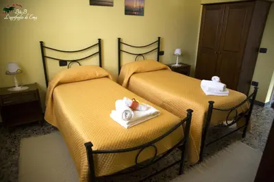 Letto o letti in una camera di L'Agrifoglio di Emy