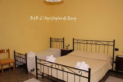 Letto o letti in una camera di L'Agrifoglio di Emy