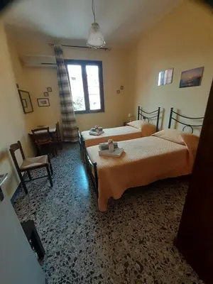 Letto o letti in una camera di L'Agrifoglio di Emy