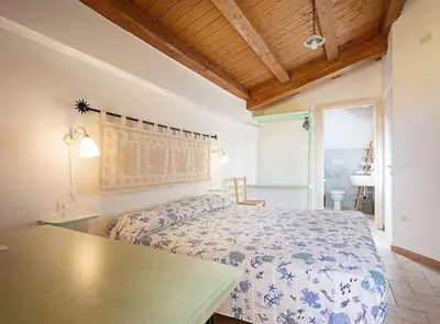 Letto o letti in una camera di Edomat