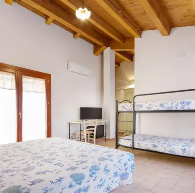 Letto o letti in una camera di Edomat
