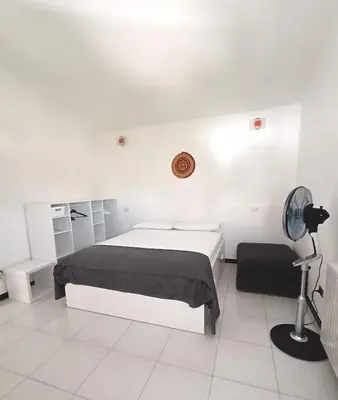 Letto o letti in una camera di Sulcis Camere