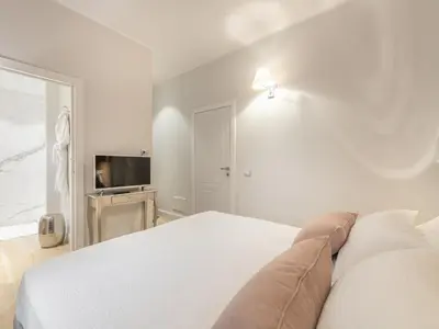 Letto o letti in una camera di AQUAMADRE Suites