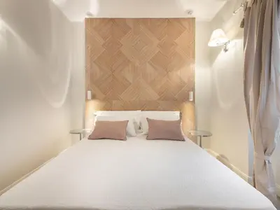 Letto o letti in una camera di AQUAMADRE Suites