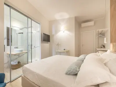 Letto o letti in una camera di AQUAMADRE Suites