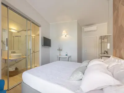 Letto o letti in una camera di AQUAMADRE Suites
